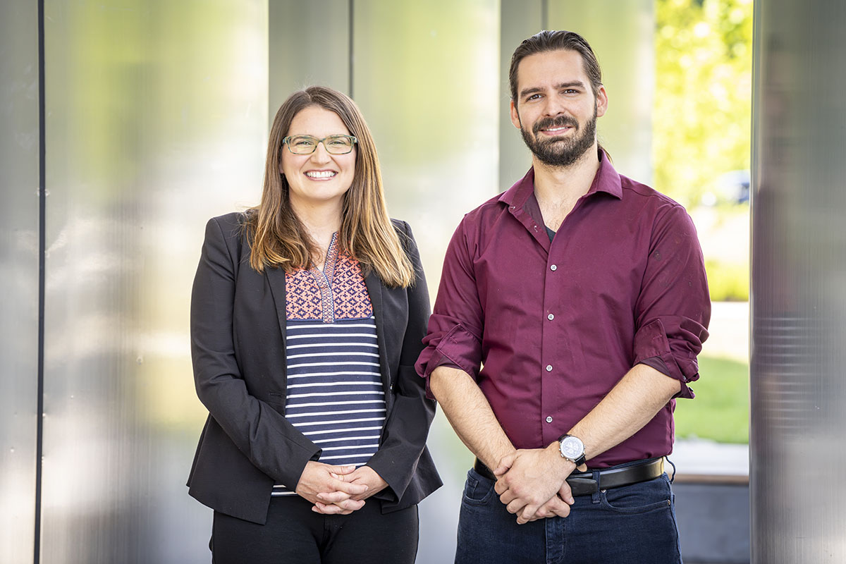 CEREBRO PIs WSE PI Amy Foster, Ph.D., and APL PI Nicholas G. Pavlopoulos, Ph.D. stand beside each other outside of a building on APL's campus.
